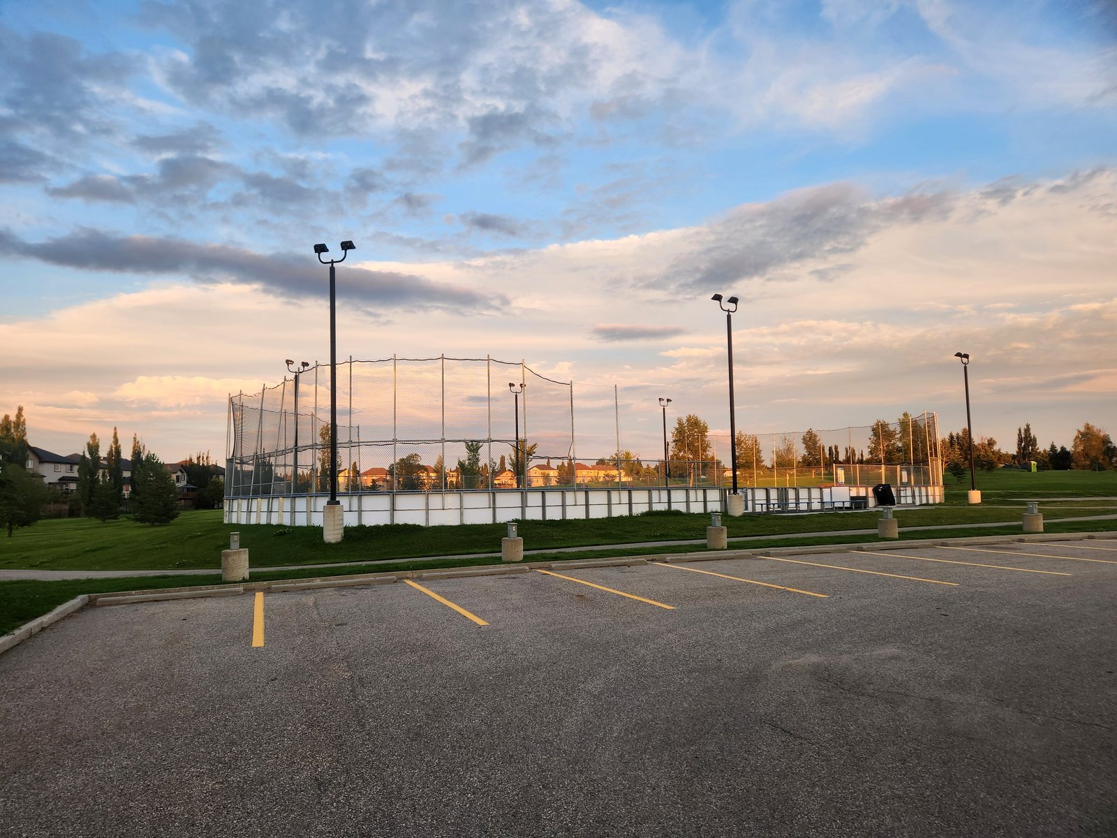 Outdoor rink and ball diamond backstops at the Dansereau Meadows school site